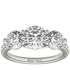 Platinum diamond ring, the bright shoulders and three stone trellis design